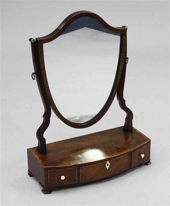 A George III mahogany tulipwood banded shield shape toilet mirror, W.1ft 5.5in.